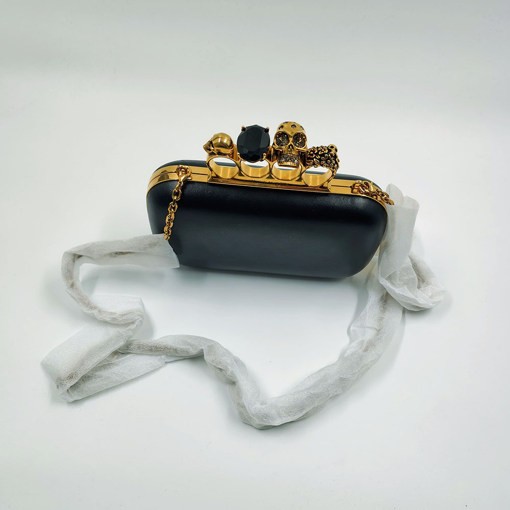 Alexander McQueen  Skull Four-Ring Clutch in Leather
